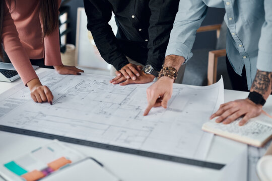 Architecture, collaboration or hands with blueprint in office for creative, innovation or design decision. Construction, floor plan or engineer team with documents for building, project or compliance