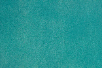 Texture of genuine leather of turquoise color for modern background, copy space