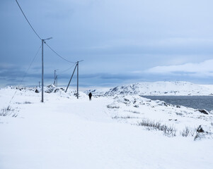 Fototapeta na wymiar snow covered seaside shore in Vardo, Norway