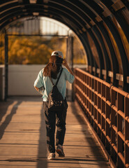 woman  walking in the bridge metro rail miami 