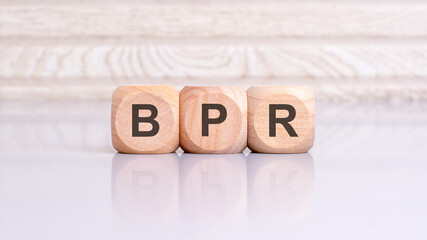 concept of BPR word on wooden cubes, wooden background