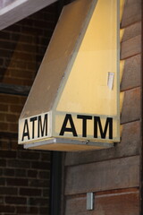 Dive Bar Outdoor ATM Machine on Wall Stock Photo