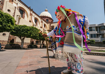 Danza de los viejitos, traditional Mexican dance originating from the state of Michoacan, Mexico. Dancing in front of the church.