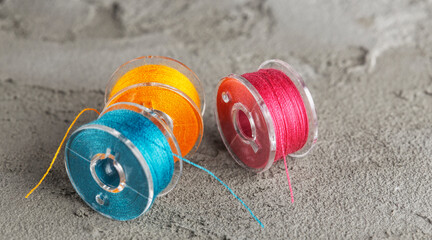 bobbins for a sewing machine with bright threads