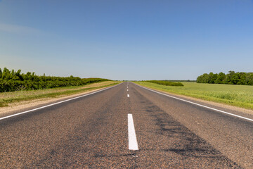 paved road with white line markings