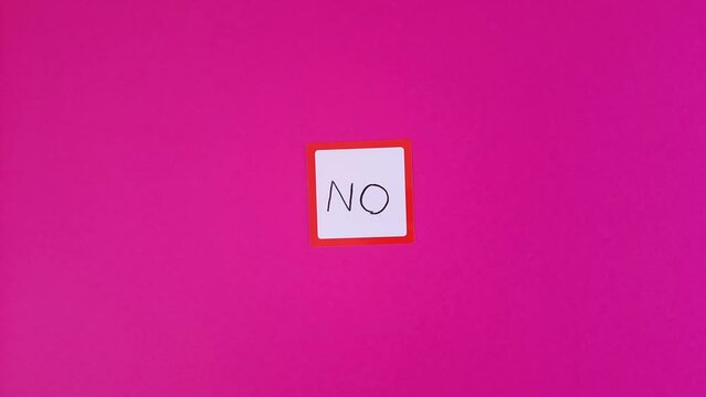 No. Text negative answer or decision, disagreement, rejection, refusal or contradiction. No is written and disappears on Sticky note.
