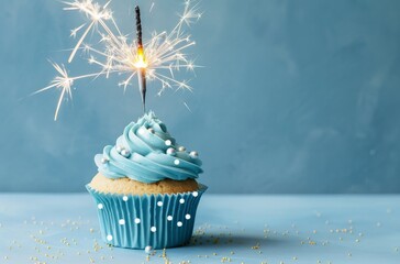 Cupcake With Blue Frosting and Sparkler - obrazy, fototapety, plakaty