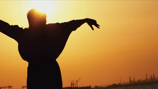 Dancing Woman Silhouette in Sunset Light