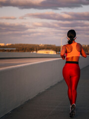 person running on the road bridge miami woman 