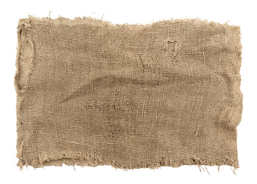 Burlap texture. A piece of torn burlap on a white background. Canvas. Packing material