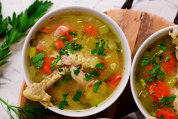 Vegetable soup with baked chicken and lemon .top veiw .style hugge