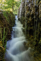 Long exposure photographs of the stone monastery waterfalls (Zaragoza-Spain) - 787498282