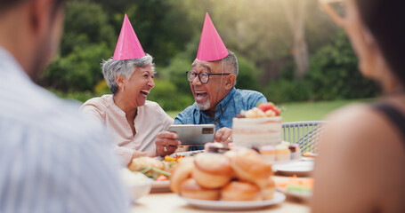 Senior, couple and happy with video call at birthday party for celebration, laughing and memories in garden. Elderly, man and woman with smartphone for photography, gathering and event in backyard
