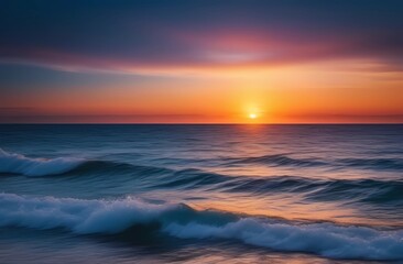 Naklejka na ściany i meble Beautiful sunset against the sea waves