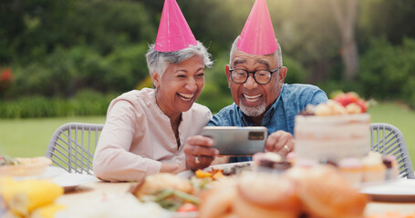 Elderly, couple and happy with video call at birthday party for celebration, laughing and memories in garden. Senior, man and woman with smartphone for photography, gathering and event in backyard - obrazy, fototapety, plakaty