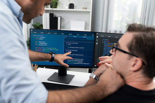 IT developers creating online software development information on screen laptop with coding program in data of application and website. Technical engineer coder on safety program concept. Sellable.