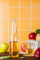 Apple cider in a bottle on a wooden table