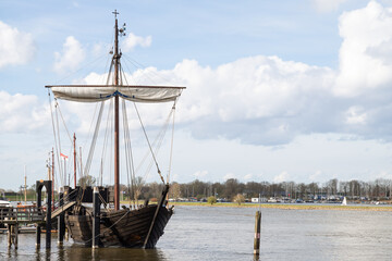 Replica of an old merchant ship -Kamper Kogge, along the river IJssel near the Dutch historic...