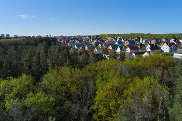Residential buildings next to the forest aerial view