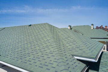 Roof of the house made of bitumen roof shingles aerial view