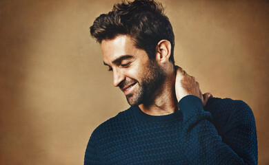 Profile, smile and man in studio, fashion and warm in winter, confidence and sweater for aesthetic....