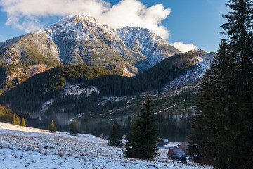 Polana Chocholowska in winter sunny day, Western Tatra Mountains, Poland. The valley and old wooden huts covered in snow © Marcin Mucharski