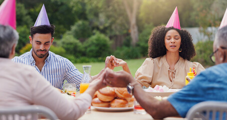 People, hand holding and pray at table for food as family or meal gratitude or religion, support or...