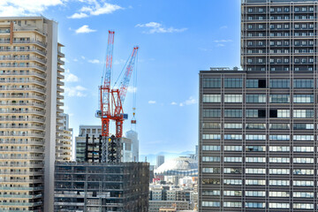 Fototapeta na wymiar Construction Cranes and Skyscrapers in Osaka