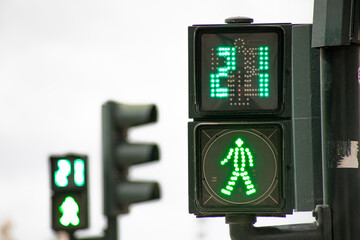 Green traffic light for pedestrians counting down in 21 seconds in Lisbon