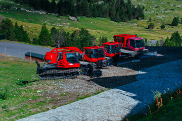 Snowplough and other specialised equipment for ski slope preparation in the Alps