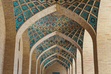 Unidentified people visiting the brilliant brick works of a Mosque in Shiraz, Iran. Perfect details.