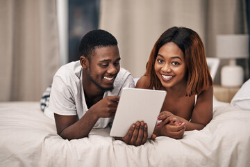 Black couple, tablet and bed in home for relax entertainment or streaming movie for resting,...