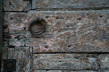 Antique door knob and wood door in Tuscany