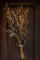 Door decoration of dried flowers and wild grass
