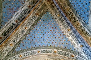 Golden stars on an old cathedral blue ceiling
