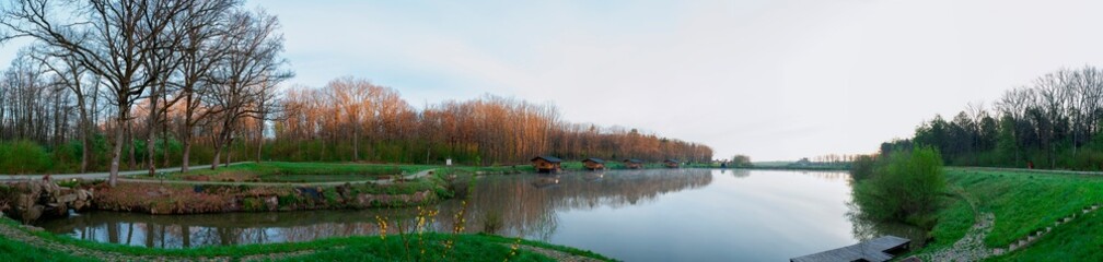 Panoramic view of a calm lake on a sunny summer day