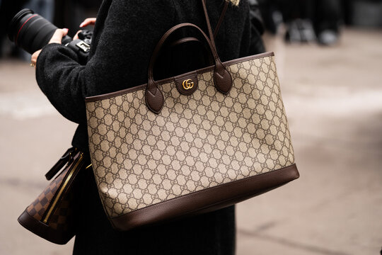Milan, Italy - February, 22, 2024: woman wears Gucci bag, fashion blogger outfit details