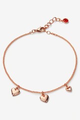 Fototapeta premium A sleek rose gold anklet embellished with tiny heart charms