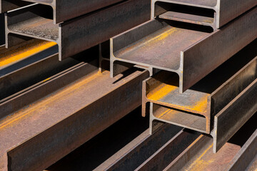 Steel construction beams at the construction site, filled with construction material. the metal...