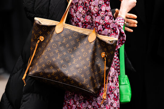 Milan, Italy - February, 25, 2024: woman wears Louis Vuitton bag, fashion blogger outfit details