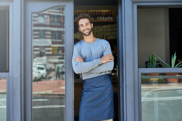 Smile, small business and portrait of man with arms crossed at coffee shop for service industry,...