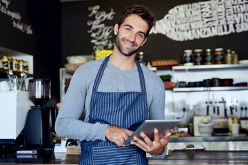 Small business, cafe and portrait of man with tablet checking online review, web or reservation in...