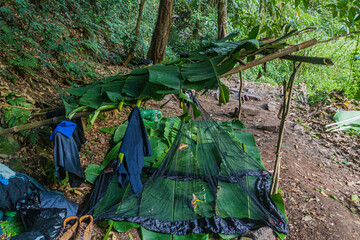 Simple shelter mado of bamboo nad banana leaves in the forest of Nam Ha National Protected Area, Laos