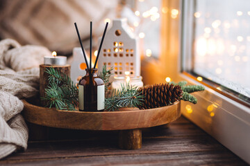 Cozy Christmas atmosphere at home. Holiday scent, aromatherapy. Fir tree fragrance, winter mood,...