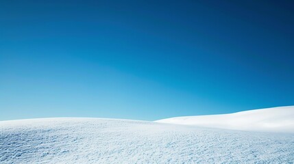 Fototapeta na wymiar pristine winter snowfield under a clear blue sky, the stark white contrasting with deep blue, a minimalist scene