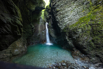 Caporetto, Slovenia. Kozjak waterfalls. Nature trail along the river with crystal clear, turquoise...