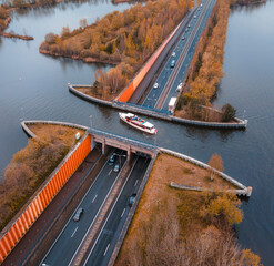 Aquaduct Veluwemeer in the Netherlands, boat passing over the highway