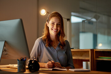 Woman, employee and smile in office with computer on work break for overtime or deadline at night....