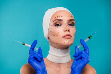 Photo of lady patient hold syringe with botox medication for plastic surgery isolated cyan color...
