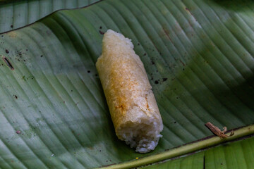 Piece of sticky rice on a banana leaf in Laos